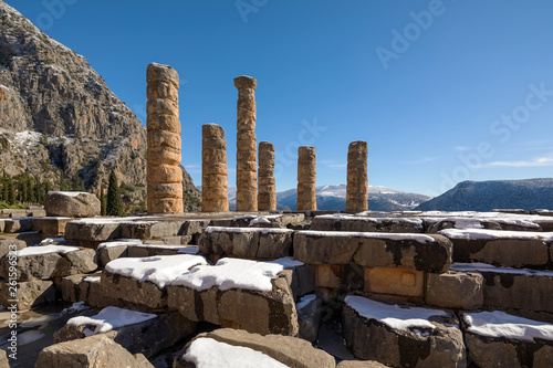 The Apollo temple ruins with snow in Delphi, Greece