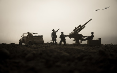 An anti-aircraft cannon and Military silhouettes fighting scene on war fog sky background. Allied air forces attacking on German positions. Artwork decorated scene.