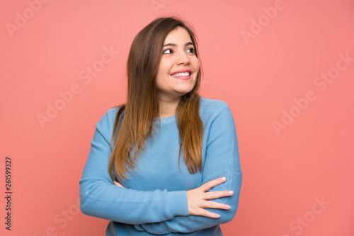 Young girl with blue sweater laughing