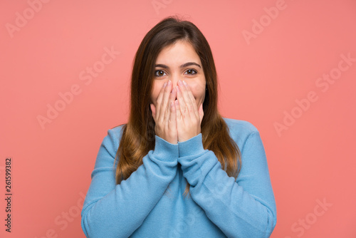 Young girl with blue sweater with surprise facial expression
