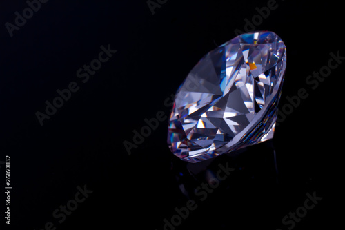Elegant Swarovski crystal on a black mirror surface  a reflection of a diamond.