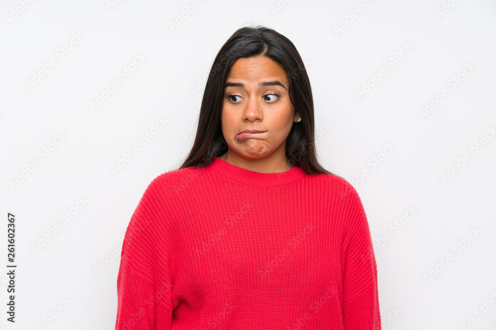 Young Colombian girl with glasses having doubts and with confuse face expression Young Colombian girl with glasses having doubts and with confuse face expression