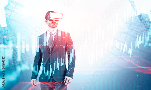 Businessman in VR headset, virtual graph