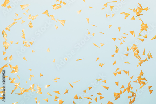 Golden confetti on a festive blue background