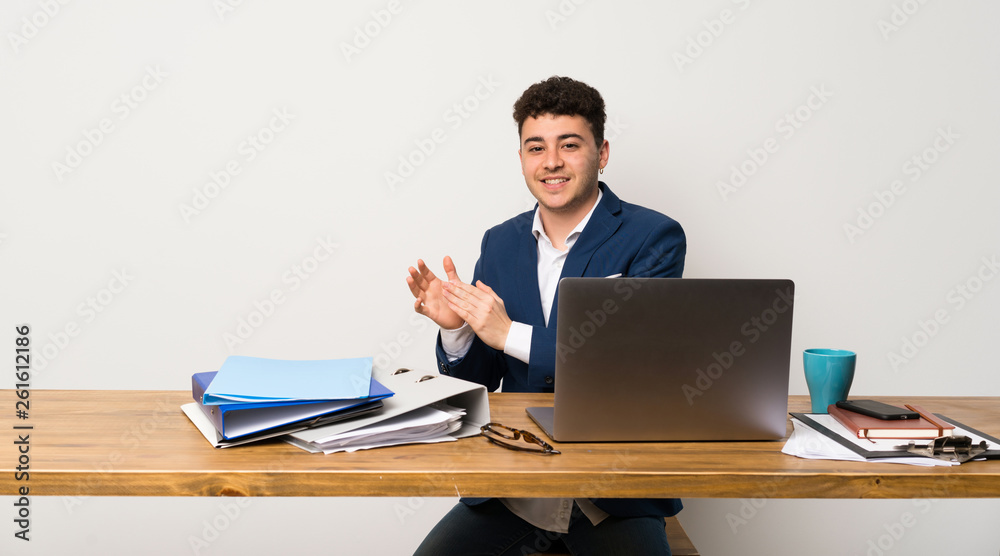 Business man in a office applauding after presentation in a conference Business man in a office applauding after presentation in a conference