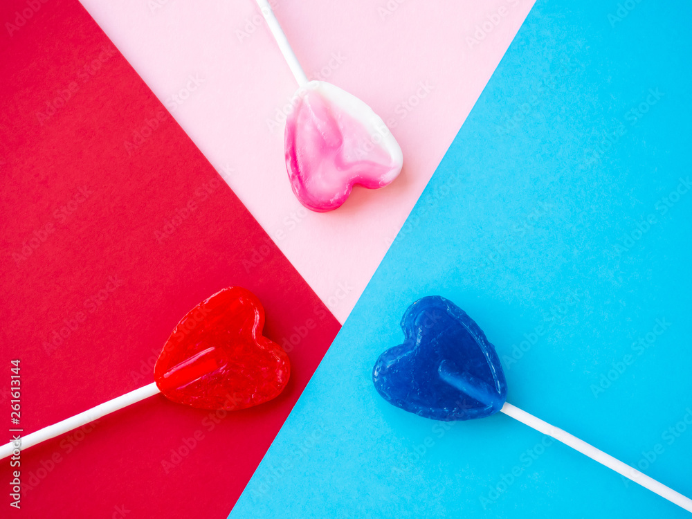 Several lollipops on a red, pink and blue background Several lollipops on a red, pink and blue background