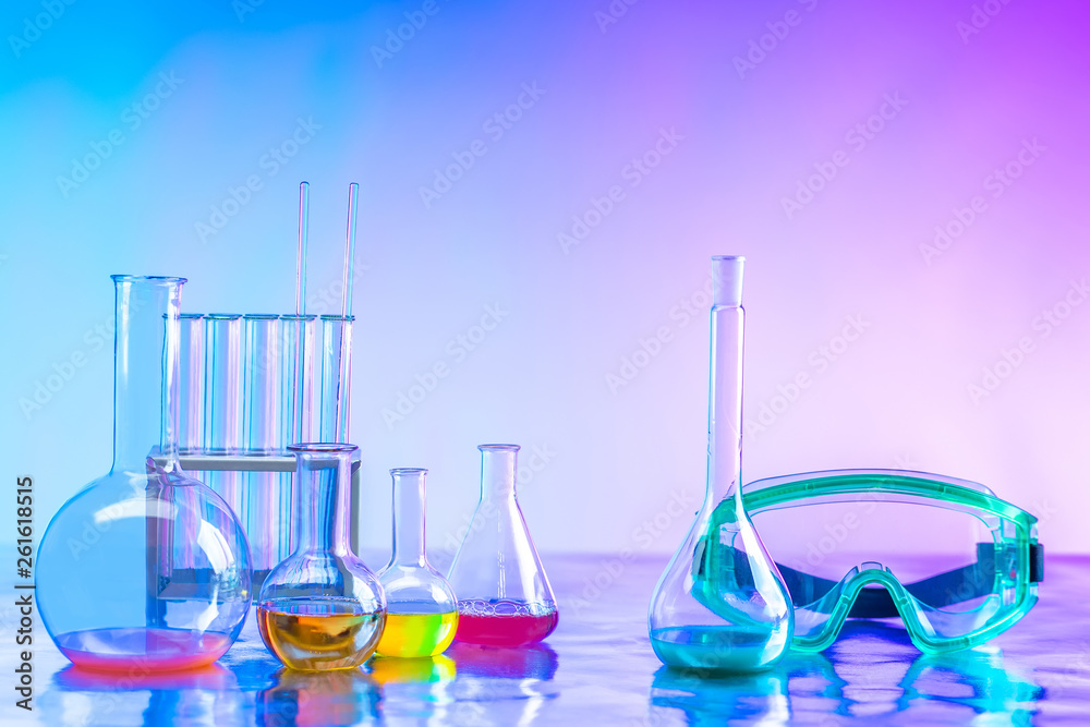 Dishes for chemical experiments. Laboratory. Metal table with flasks. Flasks with chemical liquids. Remedy. Dishes for chemical experiments. Laboratory. Metal table with flasks. Flasks with chemical liquids. Remedy.