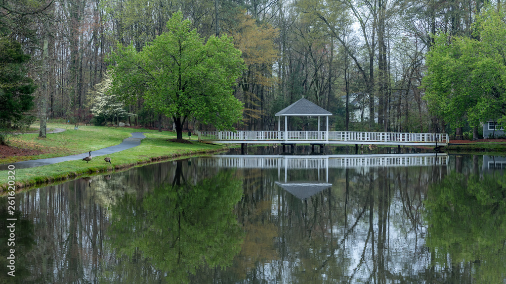 Gazebo on bridge going over pond