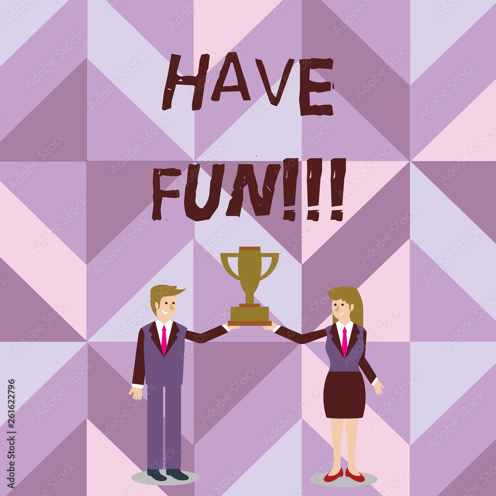 Handwriting text writing Have Fun. Conceptual photo wish somebody good and enjoyable time when they do something Man and Woman in Business Suit Holding Together the Championship Trophy Cup