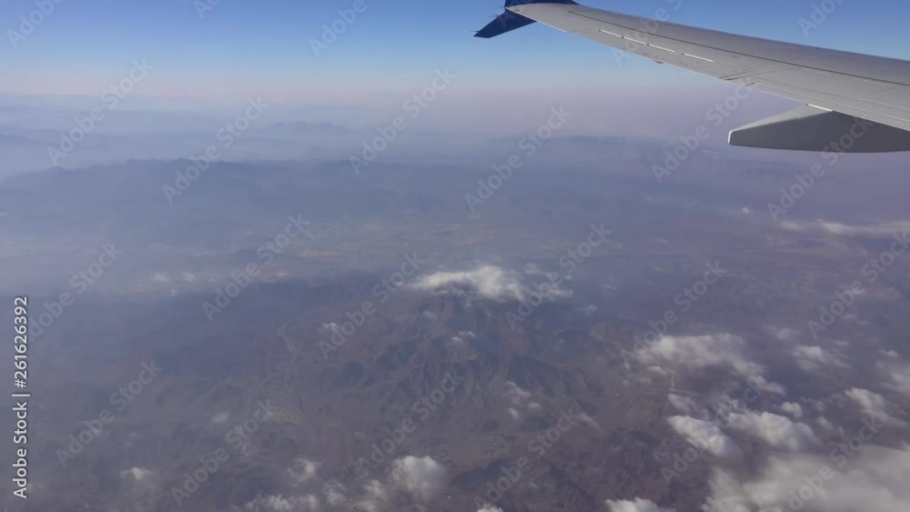 View from an airplane flying over the mountains of Central Asia, 4k View from an airplane flying over the mountains of Central Asia, 4k
