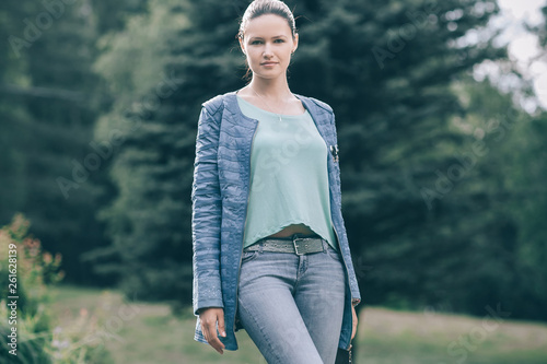 in full growth. portrait of a young modern woman .