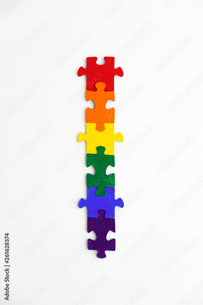 concept of equality of different sexual segregations: LGBT pride flag, built from a puzzle, short focus, top view concept of equality of different sexual segregations: LGBT pride flag, built from a puzzle, short focus, top view