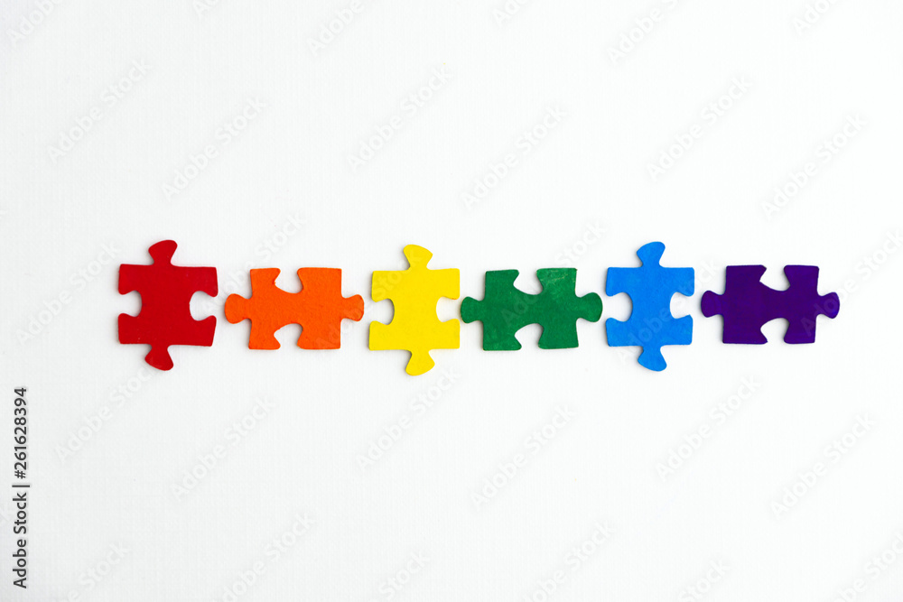 concept of equality of different sexual segregations: LGBT pride flag, built from a puzzle, short focus, top view concept of equality of different sexual segregations: LGBT pride flag, built from a puzzle, short focus, top view