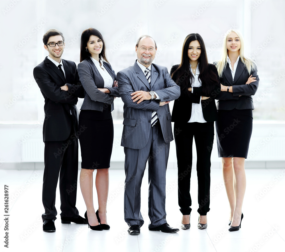 leader and successful business team on blurred background leader and successful business team on blurred background