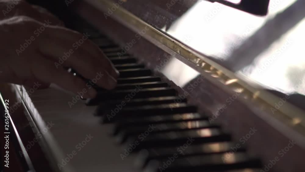 Musicial plays piano, in Slow Motion video, in a room with natural light Musicial plays piano, in Slow Motion video, in a room with natural light