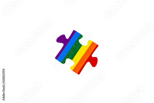LGBT badge: rainbow flag of sexual minorities depicted in the shape of a puzzle, isolated on white