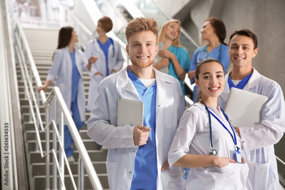 Group of medical students in college hallway Group of medical students in college hallway