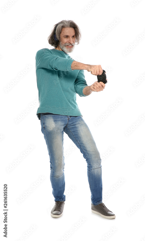 Emotional mature man playing video games with controller isolated on white Emotional mature man playing video games with controller isolated on white