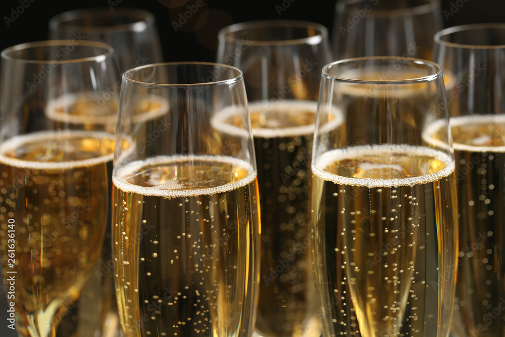 Glasses of champagne on dark background, closeup Glasses of champagne on dark background, closeup