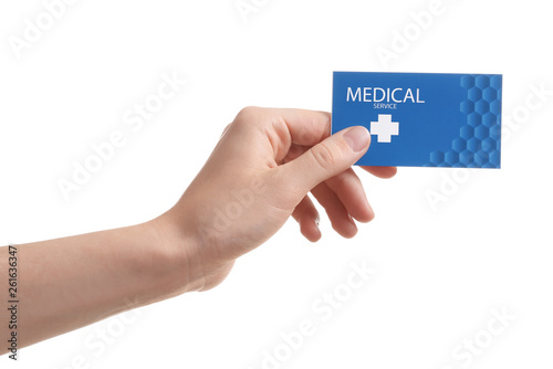 Woman holding business card isolated on white, closeup. Medical service