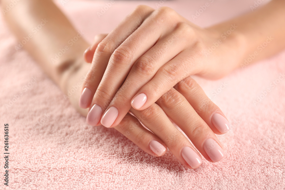 Closeup view of beautiful female hands on towel. Spa treatment