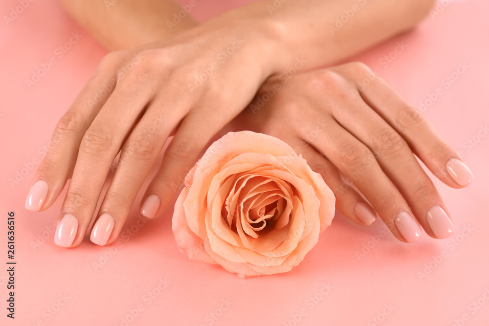 Closeup view of woman with rose on color background. Spa treatment