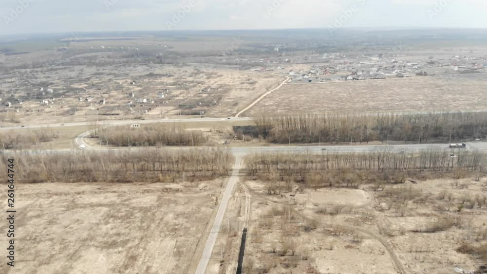 Aerial top view of summer trees, roads in forest background. Aerial view of crooked path of road. Aerial view of cars driving on country road in forest. Aerial top view of summer trees, roads in forest background. Aerial view of crooked path of road. Aerial view of cars driving on country road in forest.