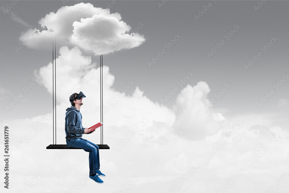 Virtual reality experience, young man in VR glasses. Mixed media Virtual reality experience, young man in VR glasses. Mixed media