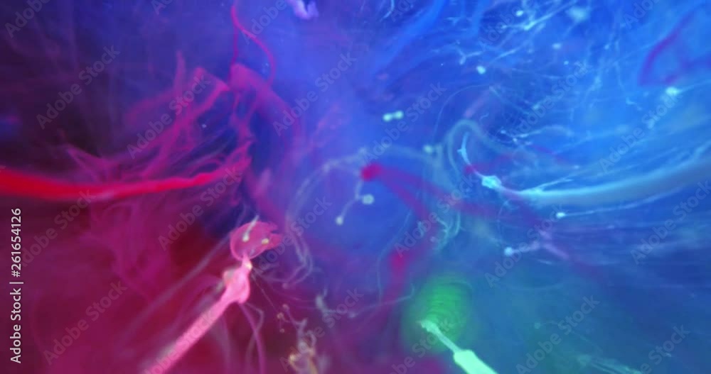 Colorful Rainbow Paint Threads and Drops Mixing in Water. Ink swirling. Underwater 4K Macro Shot. Colorful Rainbow Paint Threads and Drops Mixing in Water. Ink swirling. Underwater 4K Macro Shot.