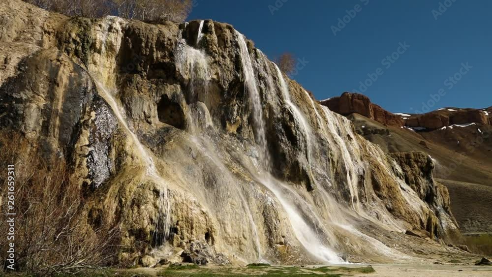Snow covered cliffs in background. Band-e Amir Lakes. Band-e Amir National Park, Bamyan Province, Afghanistan. Low Angle. Snow covered cliffs in background. Band-e Amir Lakes. Band-e Amir National Park, Bamyan Province, Afghanistan. Low Angle.