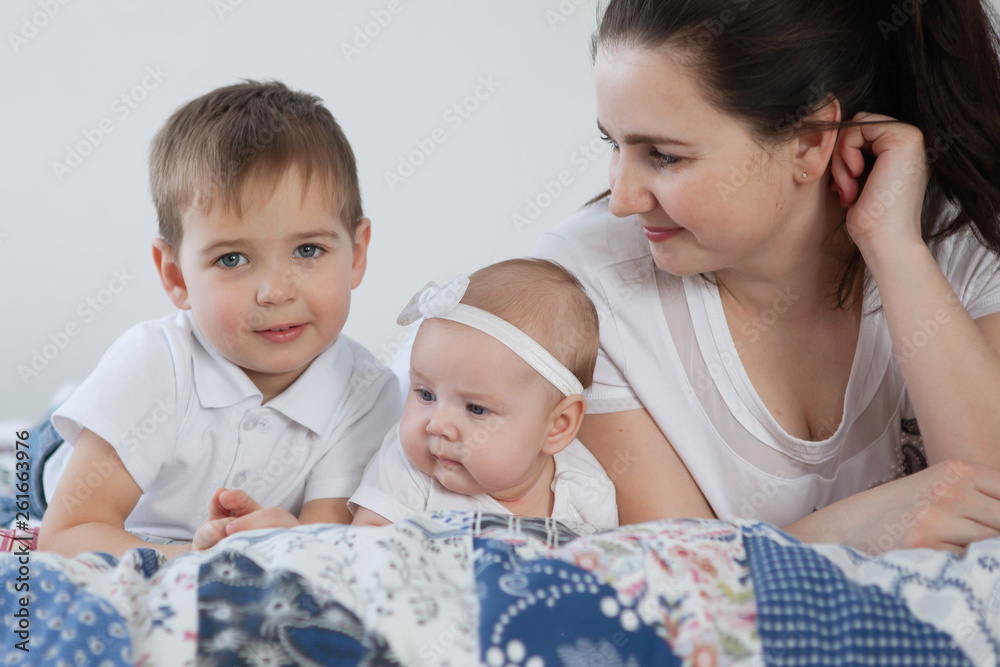 Mother, baby daughter and boy son communicate and have fun. Mother, baby daughter and boy son communicate and have fun.