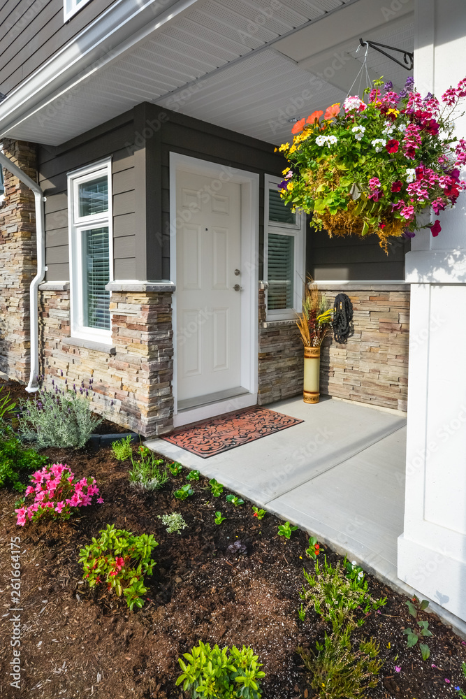 Entrance of brand new townhome decorated with flowers