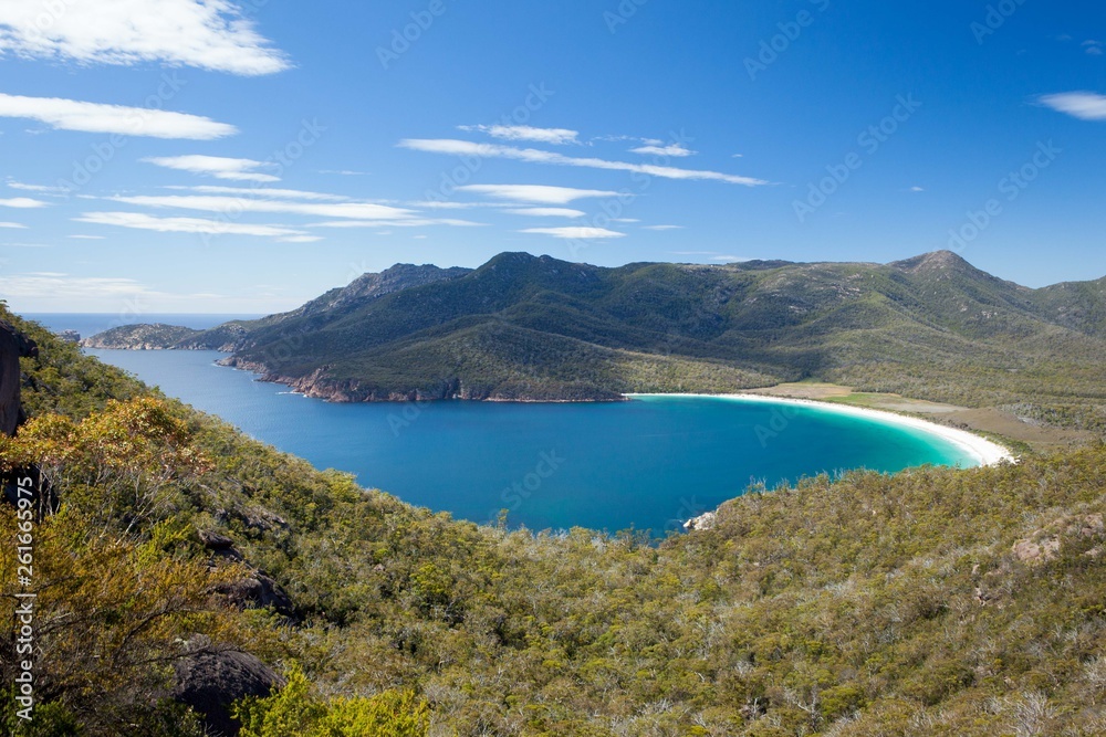 Wineglass Bay (Freycinet, Tasmania) is a picture postcard destination boasting a long crescent beach of white fine sand and crystal clear water.