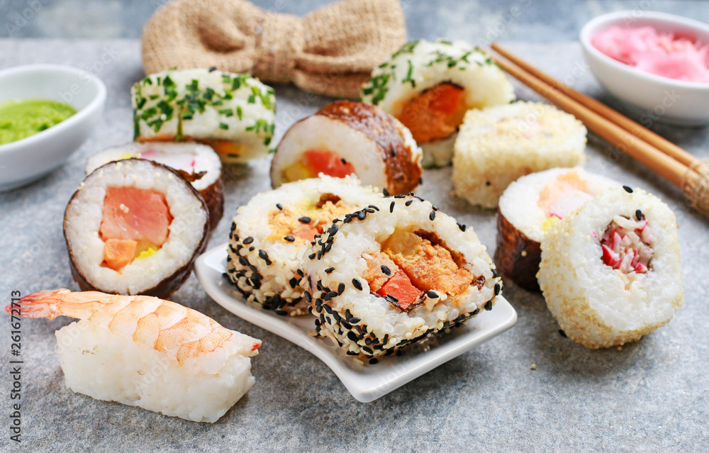 Sushi set on grey stone background. Sushi set on grey stone background.