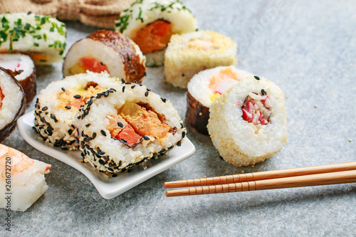 Sushi set on grey stone background.