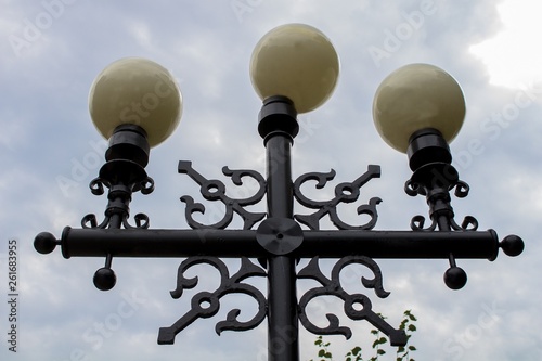 Street light. Triple lantern. Lamp.