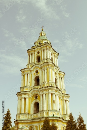 Church, temple, dome against the blue sky. Cross.