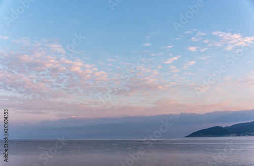 Mirror Still Mediterranean Sea on the Southern Italian Coast at Sunrise © JonShore