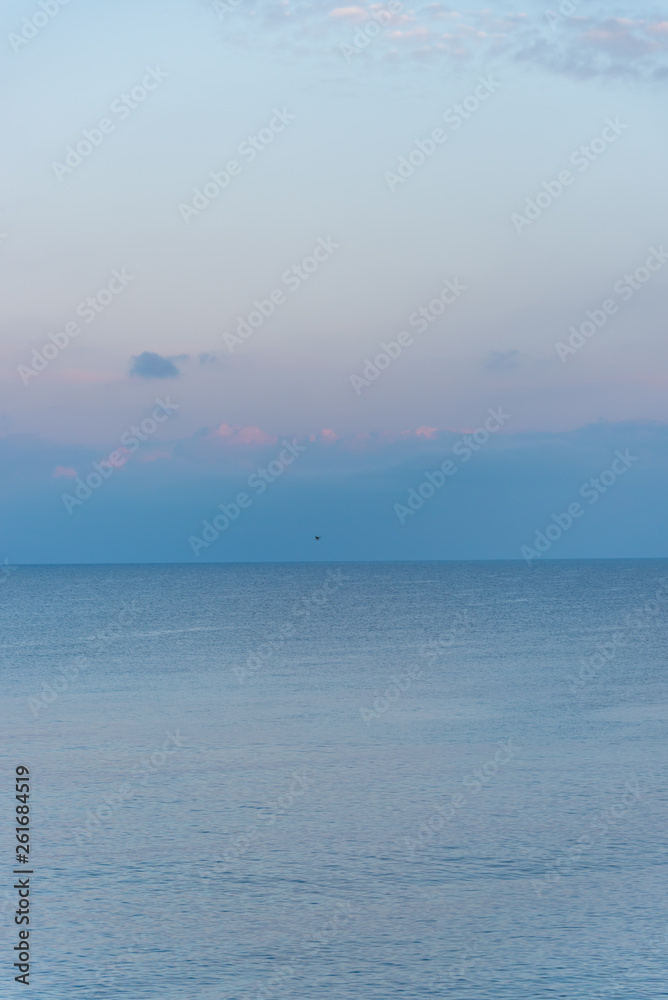 Mirror Still Mediterranean Sea on the Southern Italian Coast at Sunrise