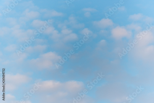 Puffy Clouds in a Blue Sky at Sunrise