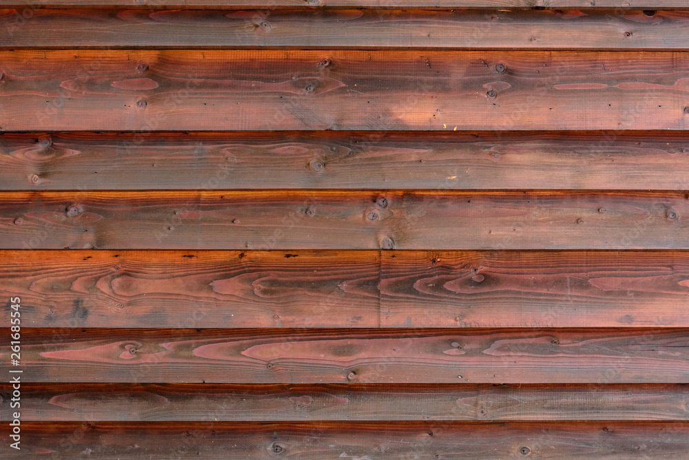 Fragments of the brown wall of wooden beams, may be used as background