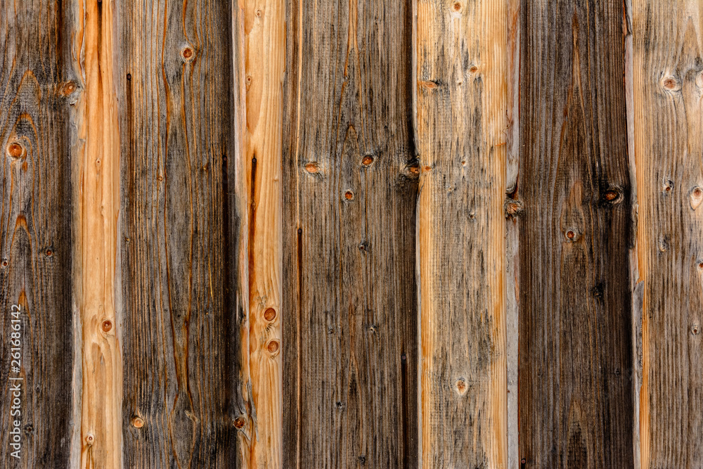 Fototapeta premium The structure of the wooden log wall, texture of wooden beams
