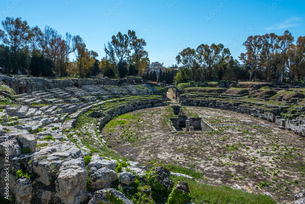 Ruins of the Greek Amphitheater at the Ancient Archeological Park in Syracuse, Sicily, Italy