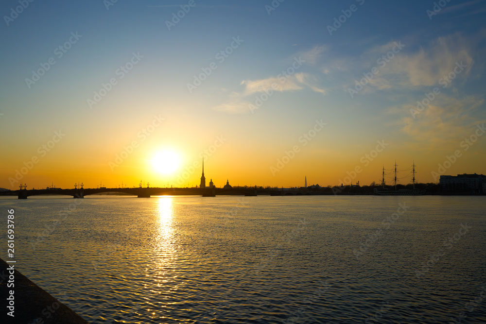 sunset over the river, St. Petersburg , view of the city of Peter and Paul Tower and the new tower lahta center.