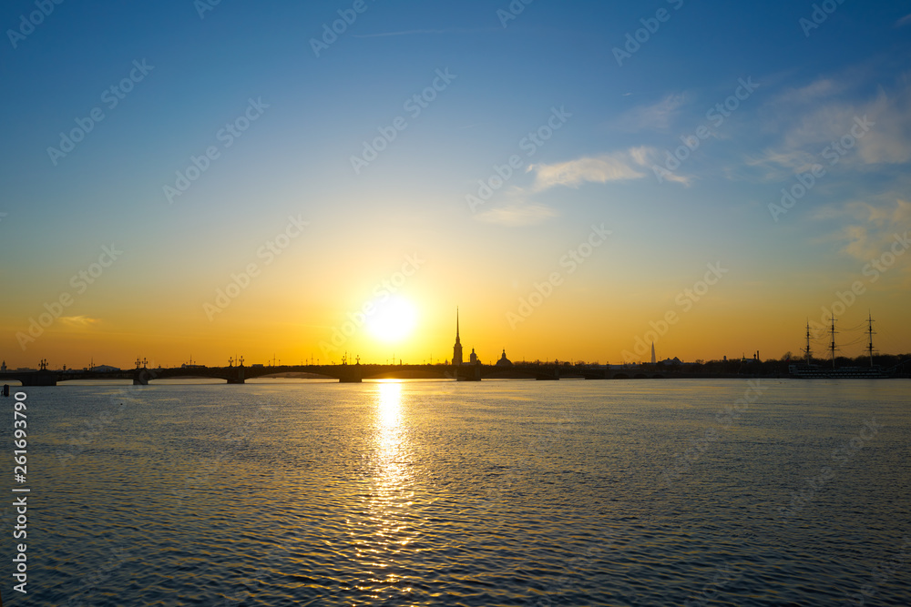 sunset over the river, Saint Petersburg, view of the city of Peter and Paul Tower and the new tower lahta center.