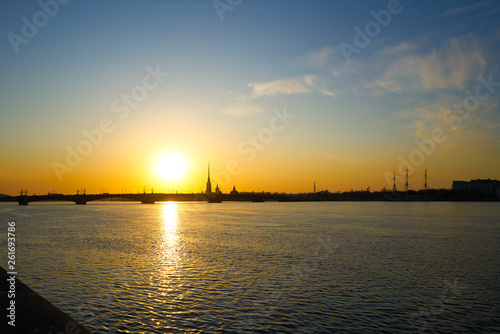 sunset over the river, St. Petersburg , view of the city of Peter and Paul Tower and the new tower lahta center. © Alex
