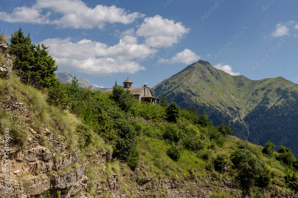 The majestic mountain and a small church on a sunny day  (region Tzoumerka, Epirus, Greece)