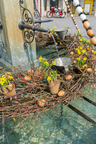 festive decorations for Easter holiday on the village fountains of the small town of Maienfeld in the Swiss Alps
