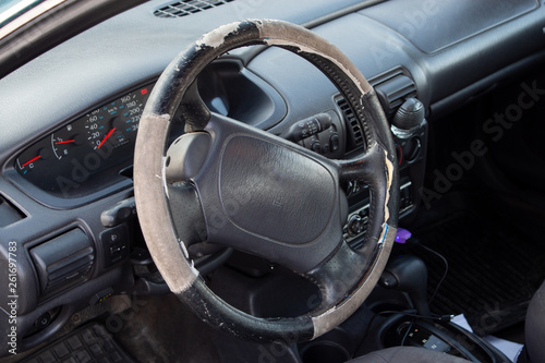 old car salon. worn steering wheel.