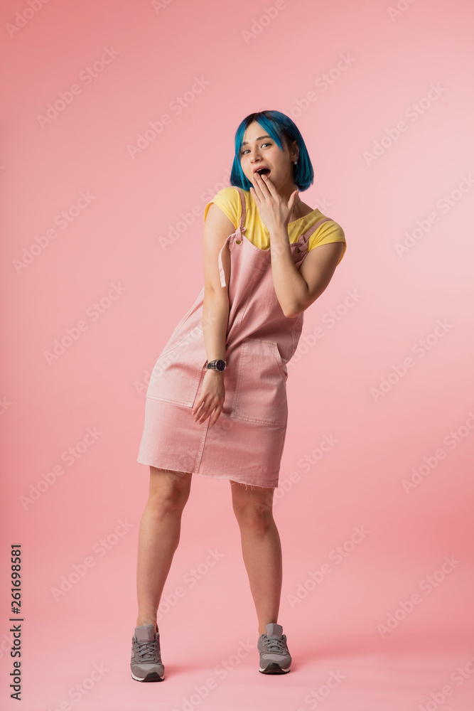 stylish scared woman closes her mouth with hand isolated over pink background. full length photo.gossip concept. word spoken is past recalling.fashion woman with new hairstyle is afraid of something stylish scared woman closes her mouth with hand isolated over pink background. full length photo.gossip concept. word spoken is past recalling.fashion woman with new hairstyle is afraid of something